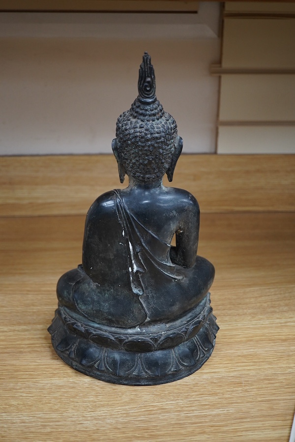 A Thai bronze seated figure of Buddha Shakyamuni, 36cm high. Condition - good